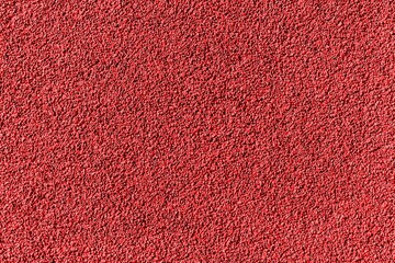 Wall Mural - Surface of Red rubber pellets in treadmill athletics field texture abstract background