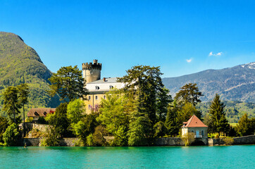 Wall Mural - Lake Annecy, a view of the Duingt Castle (Château de Duingt) and the surrounding French Alps. France