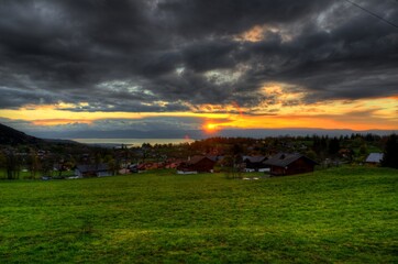 View of the sunset over the Geneva lake from the side of the mountain village