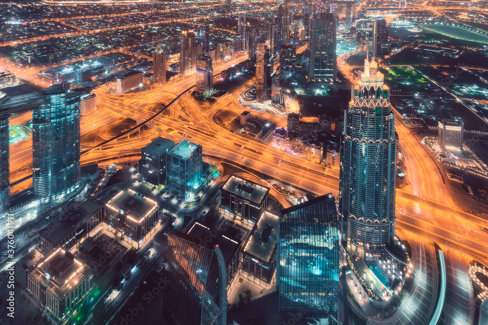 Futuristic skyline of downtown in Dubai city at night - obrazy, fototapety, plakaty 