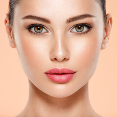 Wall Mural - portrait of beautiful young brunette woman with clean face. closeup face of young adult woman with c