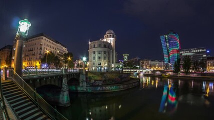 Wall Mural - Panoramic view of Urania with other buildings and Danube Canal day to night transition timelapse in Vienna. Urania is a public educational institute and observatory