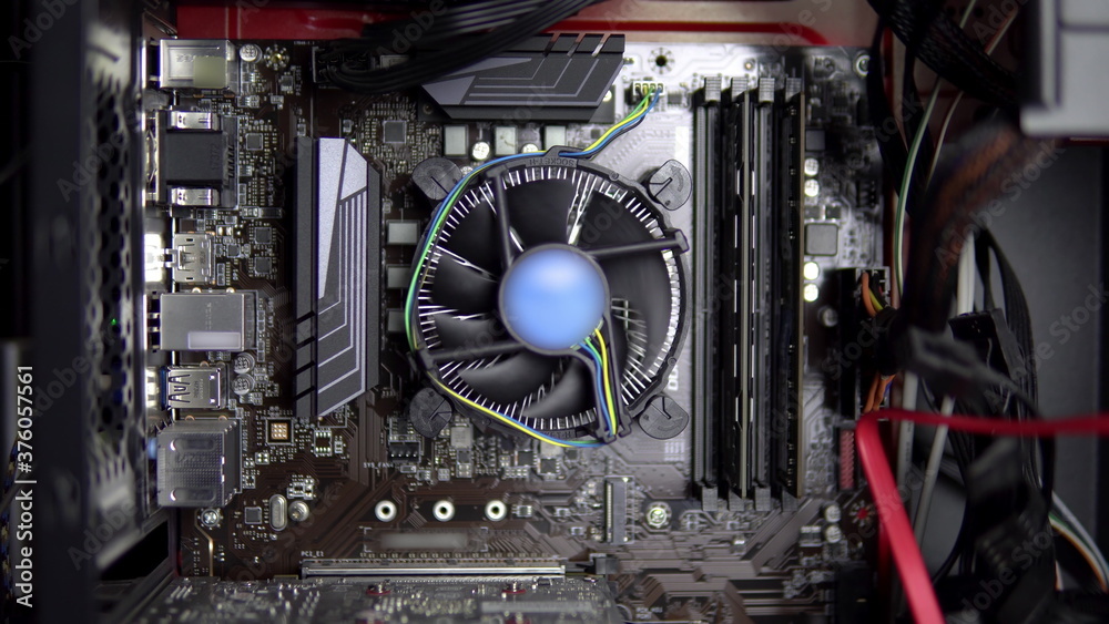 Spinning Computer Processing The processor cooler on the motherboard is spinning. CPU cooling system ...