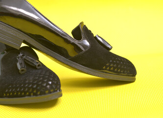 Pair of female summer shoe on yellow background