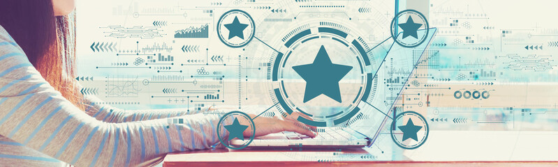 Wall Mural - Rating star concept with woman working on a laptop in brightly lit room