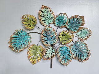 Old Rusty Decorative Steel Leaves on Gray Wall