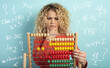 © alphaspirit - Girl with abacus is confused about the sum . cyan background