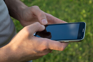 man both hands on mobile phone