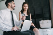 © Mego-studio - Two business people using credit card for online payment.