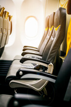 Empty Seats And Window Inside An Aircraft , Inside The Plane In Sunrise SkyEmpty Seats And Window Inside An Aircraft , Inside The Plane In Sunrise Sky