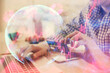© peshkova - Double exposure of man hands holding a credit card and internet business theme drawing. Digital fintech and E-commerce concept.