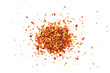 Pile crushed red pepper, dried chili flakes and seeds isolated on white background.