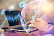 © peshkova - Double exposure of man's hands holding and using a digital device and forex graph drawing. Financial market concept.