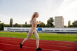 © Maria - Beautiful young blonde woman runs on a treadmill in the stadium