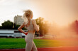 © Maria - Beautiful young blonde woman runs on a treadmill in the stadium