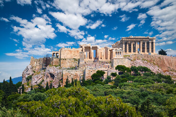 great view of acropolis hill from pnyx hill on summer day with great clouds in blue sky, athens, gre