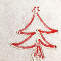 Wall Mural - Christmas tree on flour background. White flour looks like snow. Top view