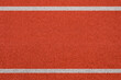 © tkroot - Top view of the running track rubber lanes cover texture with white line marking for background.