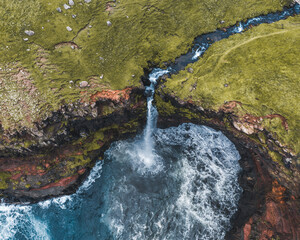 Wall Mural - aerial drone panorama of mulafossur waterfall, vagar, faroe islands, denmark. rough see in the north