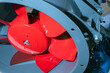Industrial axial fan. Red fan in production close-up. Concept - industrial cooling systems. Air cooling in production. Fan screw painted red. Sale of cooling systems. Parts for ventilation systems.