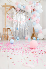 Wall Mural - Gender party decorations - gifts, toys, balloons, garland and figure for little baby party on a white wall background.