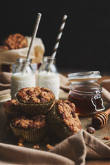 Sticker - Selective focus shot of delicious Christmas cookie muffins on a plate with honey and milk