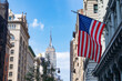 © James - American Flag on a Manhattan Street with Skyscrapers in New York City