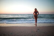 © Ванжа Юрий - young woman walking on the beach