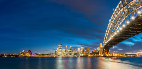 Fototapete - Colorful Sydney downtown skyline with harbor bridge at night in Sydney, New South Wales, Australia