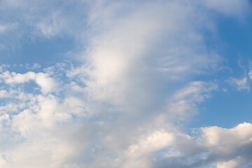 Wall Mural - Cirrocumulus clouds in the light blue sky background