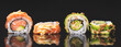 Sushi roll set on black glass background