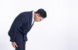 © Ann Rodchua - Asian business man bowing on white background