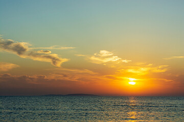 Summer sunset over the blue sea