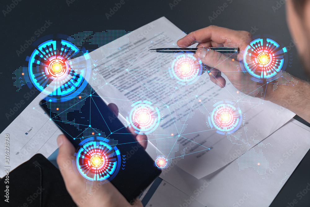 Double exposure of man signing contract with phone and world map ...
