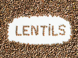 Fototapeta Paryż - Overhead shot of lentils with their name formed by lentils on white background.