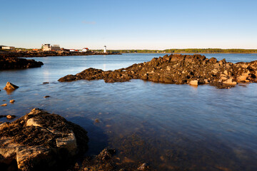 Wall Mural - Portsmouth Harbor Lighthouse at Sunset with low tide. Portsmouth Harbor Lighthouse is a historic lighthouse located within Fort Constitution in New Castle, New Hampshire, United States.