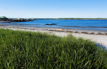 Wall Mural - Portsmouth Harbor Lighthouse at Sunset with low tide. Portsmouth Harbor Lighthouse is a historic lighthouse located within Fort Constitution in New Castle, New Hampshire, United States.