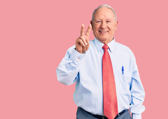 Senior handsome grey-haired man wearing elegant tie and shirt showing and pointing up with fingers number two while smiling confident and happy.