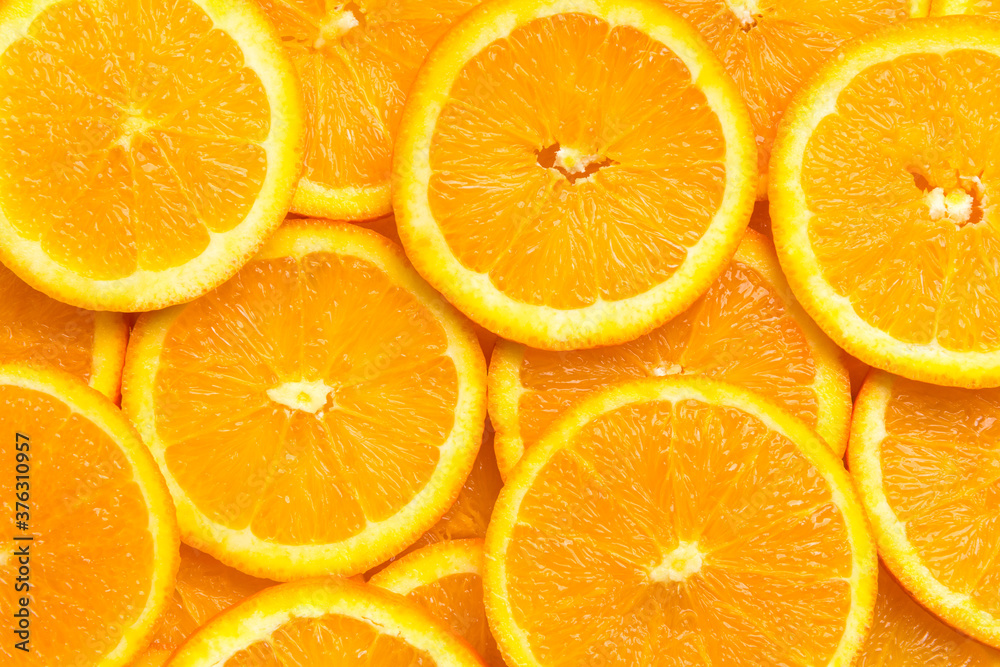 Full frame of fresh orange fruit slices pattern background, close up, high angle view - obrazy, fototapety, plakaty 