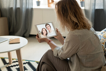 Poster - Contemporary mature female communicating to her daughter or son with date