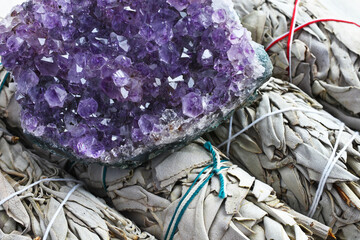 Wall Mural - A close up image of white sage and sparkling amethyst geode. 