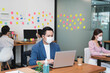 © Ann Patchanan - asian small business startup group wearing protective mask for covid19 protection corona flu prevent healty ideas concept office background.The work with new normal lifestyle in office.