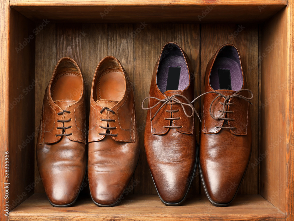 Leather male shoes in wooden box