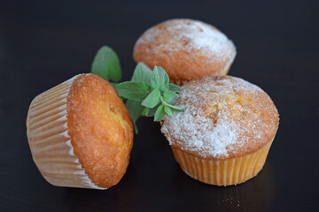 Wall Mural - Muffins - delicious pastries. Delicious dessert on the table - homemade muffins. Portioned cupcakes. 