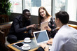 © Watercolor_Concept - Happiness young business relaxation meeting and discuss job at restaurant.