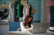 © themorningglory - Successful happy girl manager in her own office working with laptop