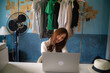 © themorningglory - Successful happy girl manager in her own office working with laptop