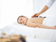 © Iryna - Young and blonde woman enjoying treatment with hot stones in spa salon. Beauty concept