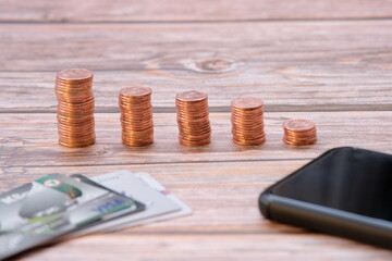 Stacks of gold money coin on black background and concept saving money 