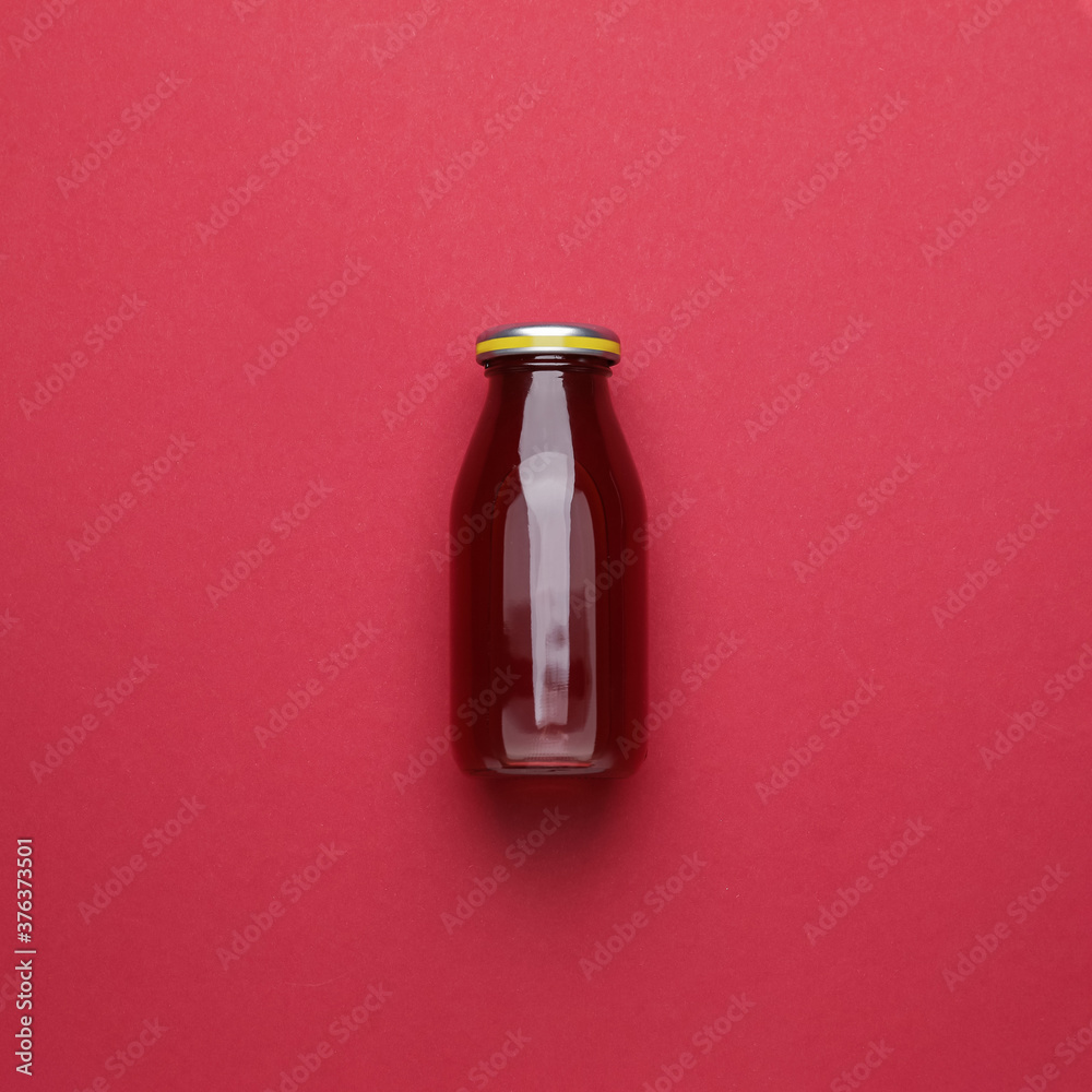 Bottle of juice on color background